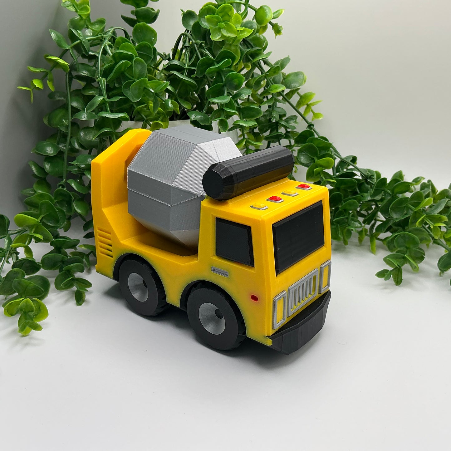 Large 3D-printed multi-coloured cement truck construction vehicle with rotating mixer drum - view 3 of 5