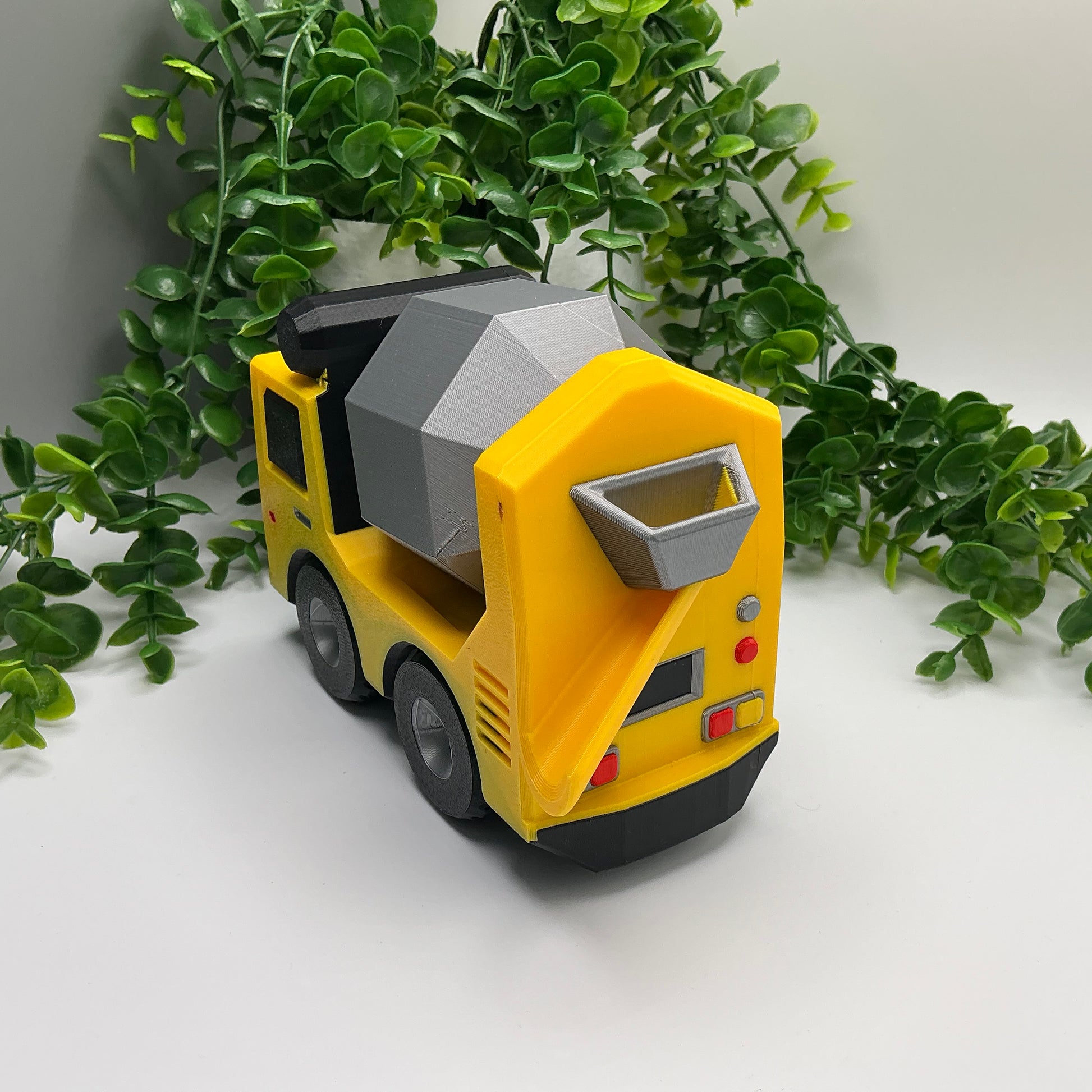 Large 3D-printed multi-coloured cement truck construction vehicle with rotating mixer drum - view 2 of 5