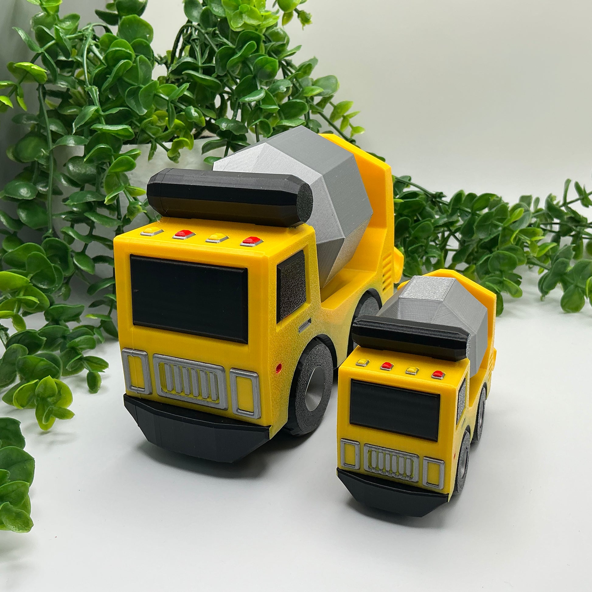 Large 3D-printed multi-coloured cement truck construction vehicle with rotating mixer drum - view 4 of 5